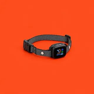 BarkBliss, the black and white weave collar with its black unit and lit screen, on a vermilion background