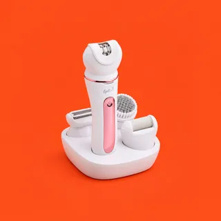 Epillax, the white epilator with its rose gold ring and pink button strip standing in its charging stand, the foil shaver head, the brush head and the roller head in the stand's cups, on a vermilion background