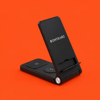 OnyxArc, the black fold flat wireless charger standing open, its upright panel and the two pads on its base, on a vermilion background