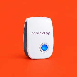 SonicStop, the white plug in ultrasonic pest repeller with its round blue light, on a vermilion background