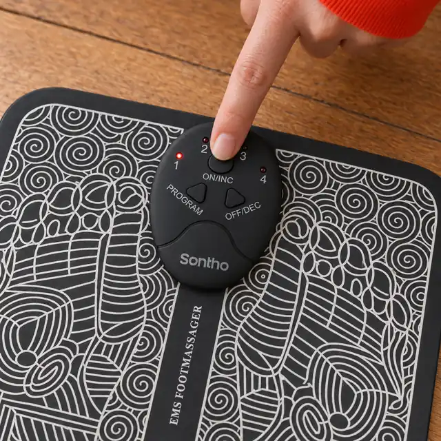 A fingertip on the ON/INC button of the black Sontho controller, the PROGRAM and OFF/DEC buttons and four small lights around it